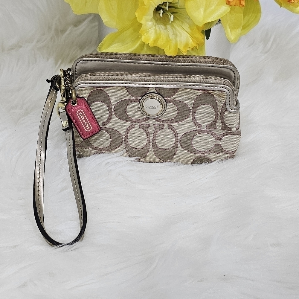 Coach wristlet monogram  tan color